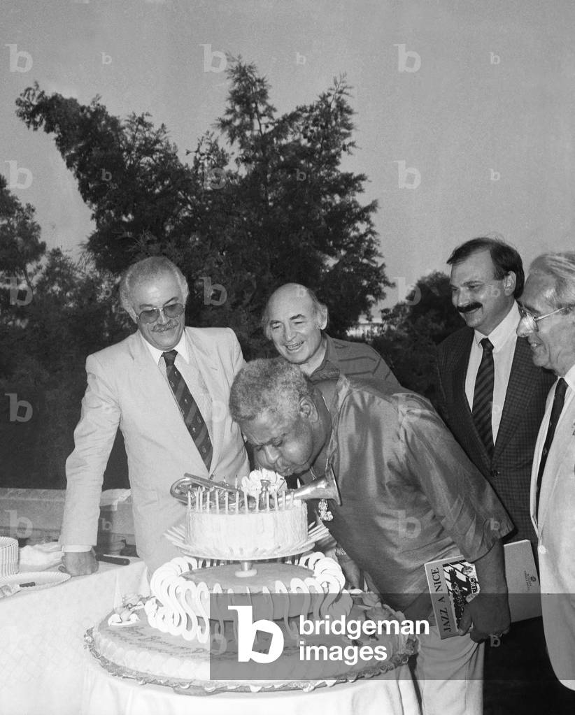 Dizzy Gillespie celebrating by advance his birthday with Jacques Medecin (l) mayor of Nice, July 13, 1987 (b/w photo)