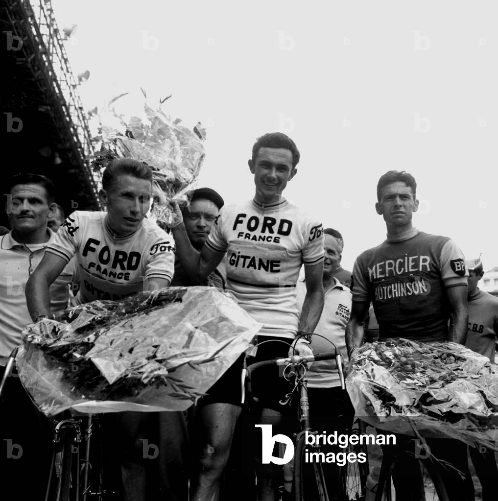Louis Rostollan (In the Centre) Wins the Race Les Boucles De Seine aux Parc Des Princes Paris June 13, 1965 Here After His Victory Surround To Right By Georges Chappe (Second) And Jacques Anquetil (Left Third) (b/w photo)