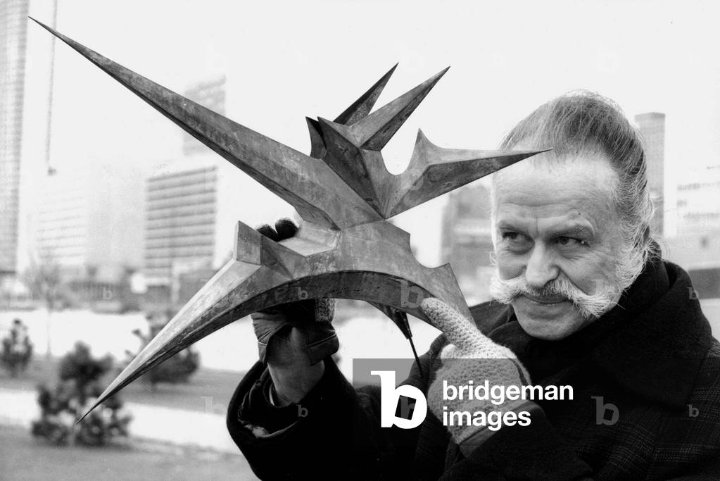 Georges Mathieu With Scale Model of The Sculpture He Made For The Sports Center in Neuilly January 7, 1982 (b/w photo)