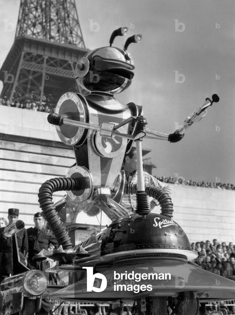 Exposition Terre Et Cosmos (Earth and Cosmos) Under The Eiffel Tower, Near The Helicopter Which Has Just Explore North Pole With Paulemilevictor, July 6, 1958 (b/w photo)