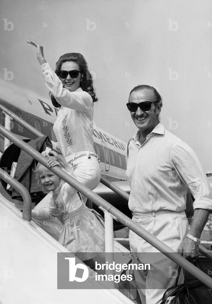 Actor David Niven With His Wife And Daughter Leaving The French Riviera For New York Here At Nice Airport July 6, 1968 (b/w photo)