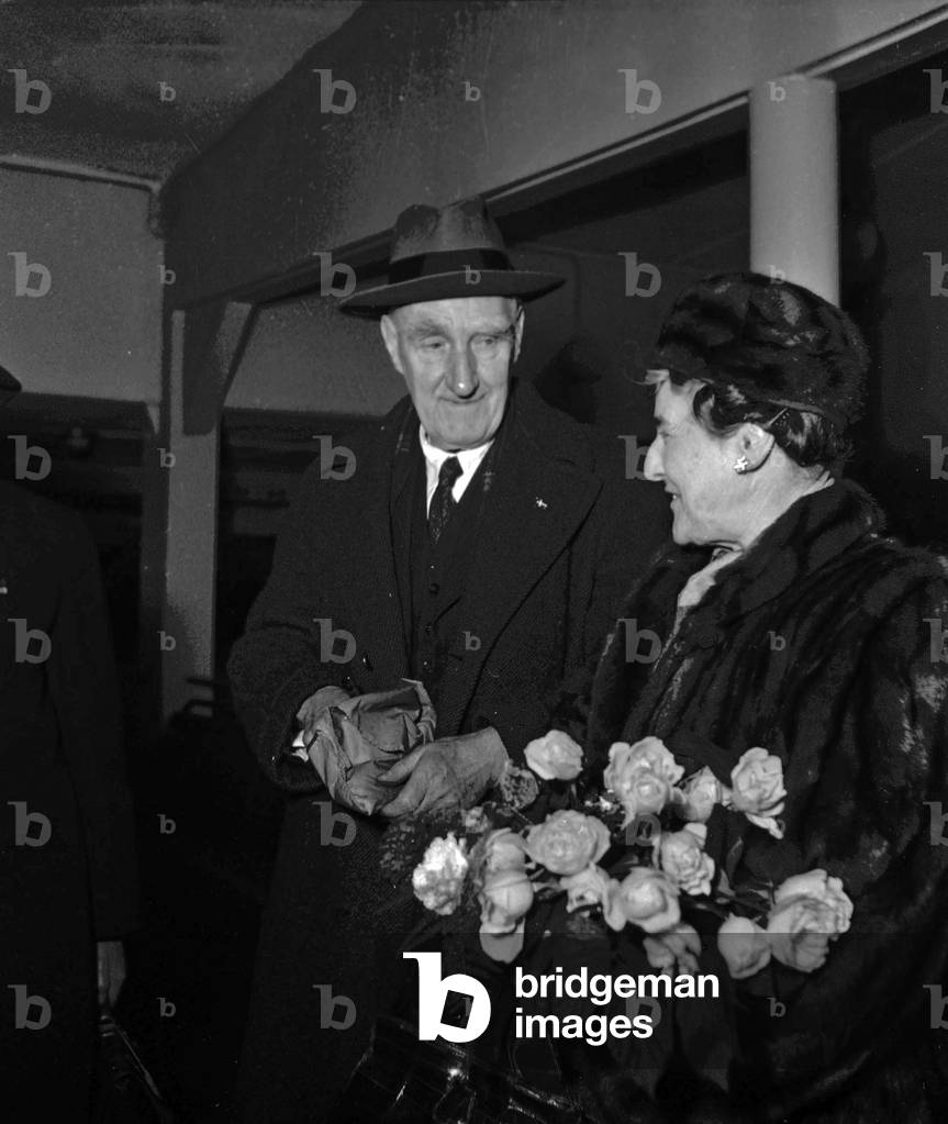 Lord Boyd Orr, Peace Nobel Prize, arriving at Bourget airport, Paris with his wife, December 15, 1949 (b/w photo)