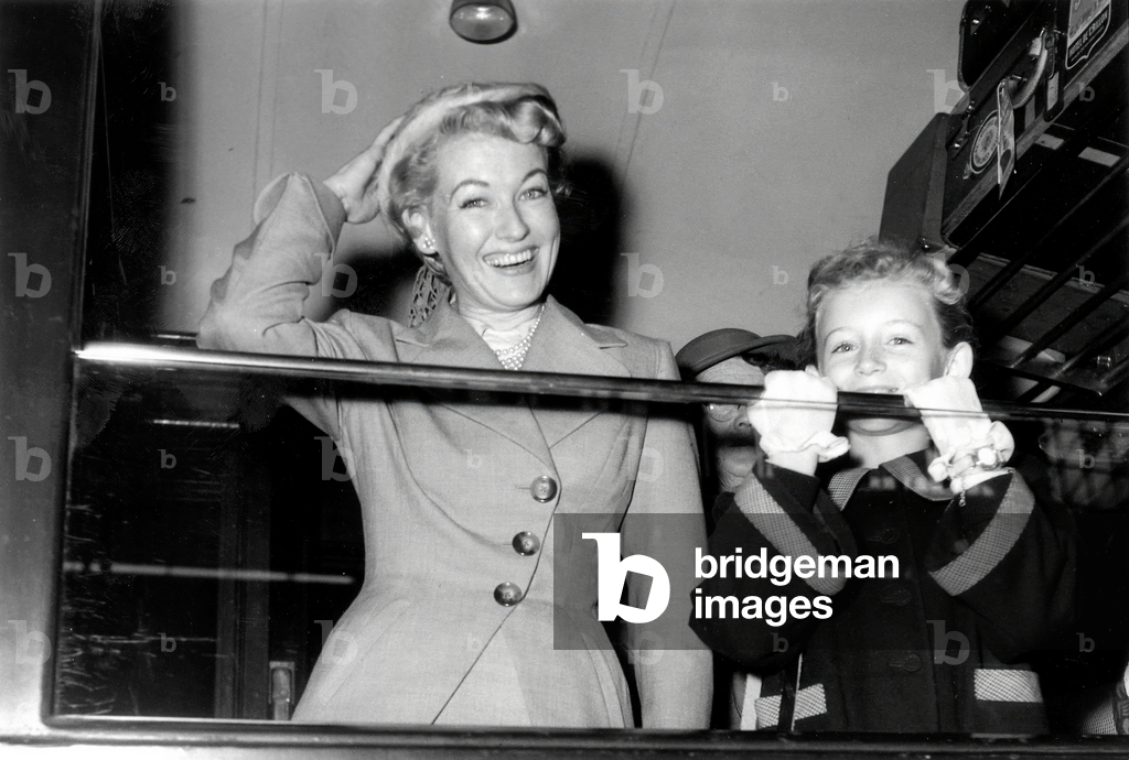 Mrs Robert Mcmannus Friend of Alfred Gwynne Vanderbilt Ii in A Parisian Station, in 1951 (b/w photo)
