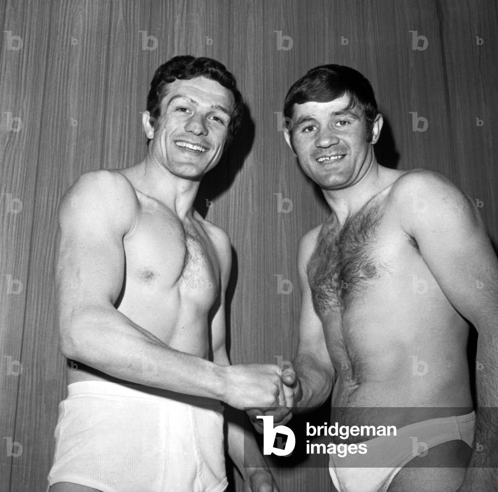 Jean Josselin (Right) Squeezes the Hand of His Challenger, Silvano Bertini Before Their Battle From which Josselin will come out Winner and thus become European Welters Champion at the Palais des Sports in Paris on May 5, 1969. Neg: D9140 (b/w photo)