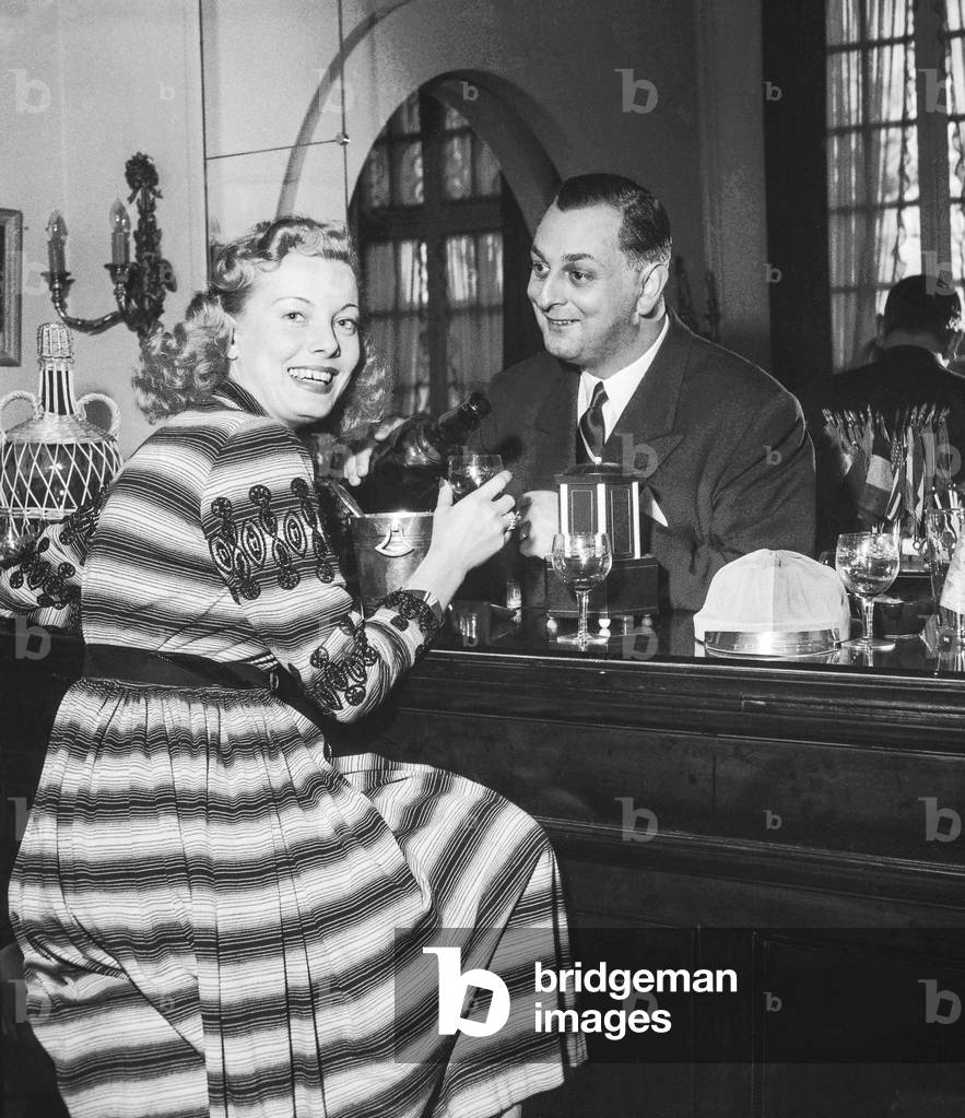 French actress Suzy Carrier and her husband Raymond Schmit at home, Le Vesinet, January 18, 1952 (b/w photo)