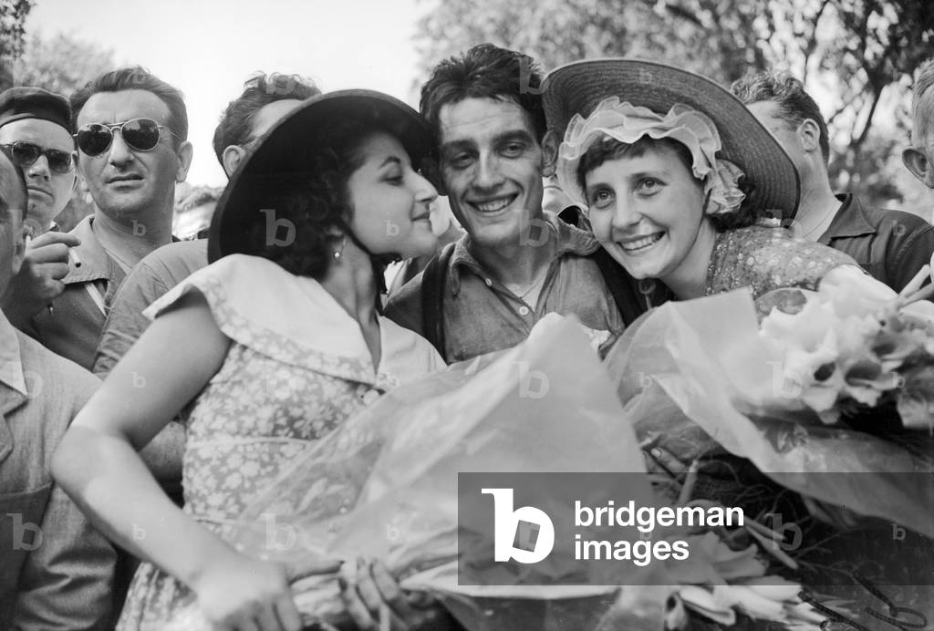 Tour De France 1953 : Cyclist Bernard Quennehen Winner of The Leg Beziers-Nimes Congratulated By Young Women in Nimes, July 17, 1953 (b/w photo)