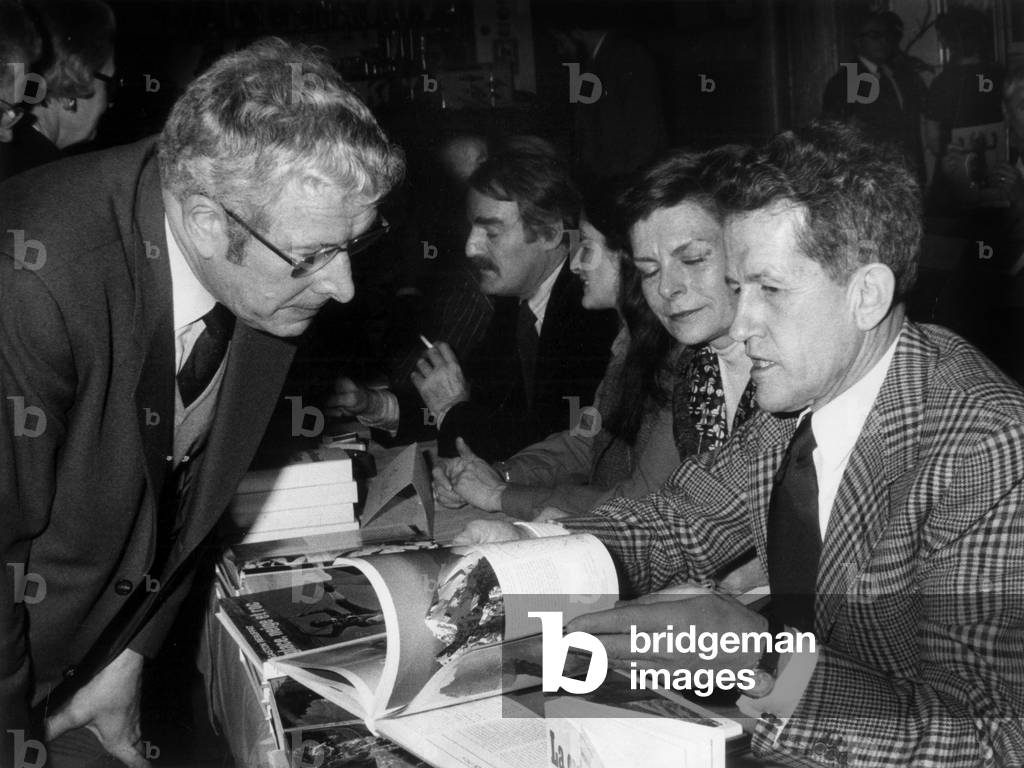 French Mountaineer Gaston Rebuffat Dedicating his Book at A Festival in Paris on February 24, 1976 (b/w photo)