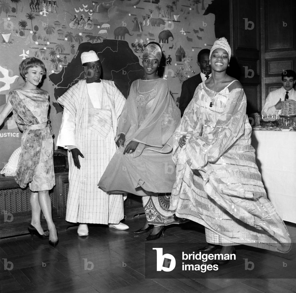 Dancer Claire Sombert, Guinean Ambassador Guinee Diakite Nama Moudou and 2 Dancers Camara Nalo and Kaba Fanta during A Reception at Embassy, Paris, January 28, 1964 (b/w photo)