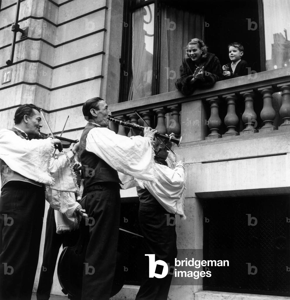 Hungarian Musicians Serenading Ingrid Bergman and her Son Robertino December 30, 1956 (b/w photo)