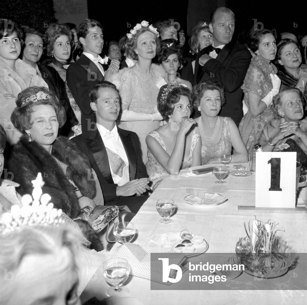 Ball of The Debutantes at The Orangery of Versailles Castle on July 1St 1960 : here at Table Queen of Italy Marie Jose (R) and One of her Daughters Princess Maria Pia of Yugoslavia (Elbow on Table) (b/w photo)