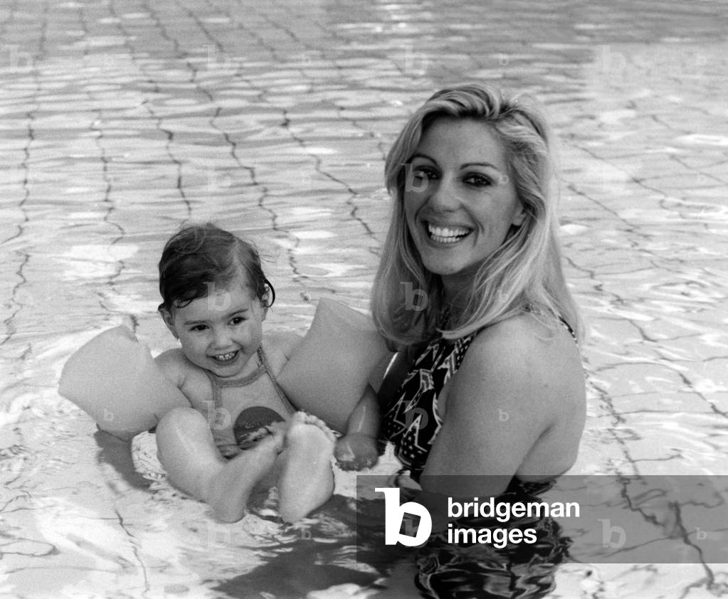 French Swimmer Christine Caron (Aka Kiki) and her Daughter in A Swimming Pool, March 7, 1977 (b/w photo)