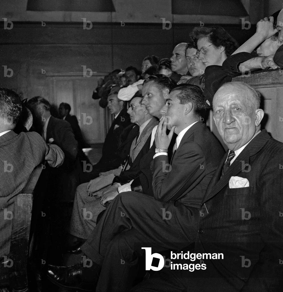 Trial of Joseph Joanovici (collaboration), Paris, July 8, 1949 : French actor Francois Perier (hand on the face) (b/w photo)