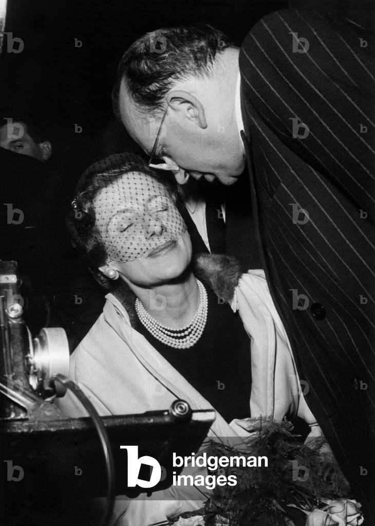 M Edgar Faure and her Husband (President of Rgr) at The Wagram Hall in Paris After A Electoral Meeting, December 26, 1955 (b/w photo)