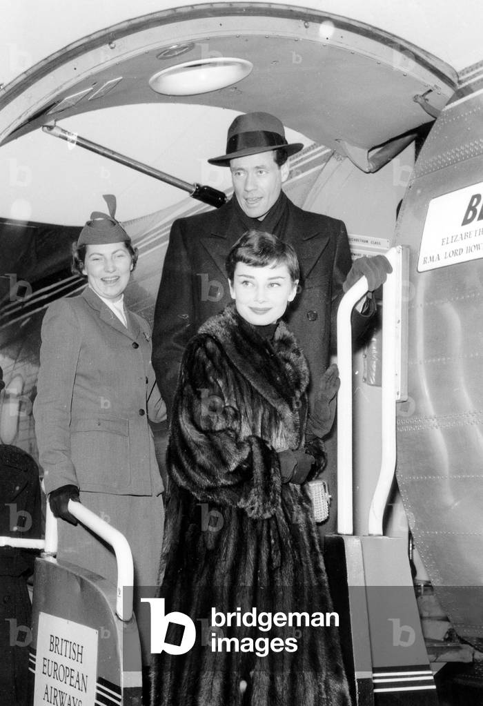 Audrey Hepburn and Husband Mel Ferrer at Paris Airport February 21, 1955 (photo)