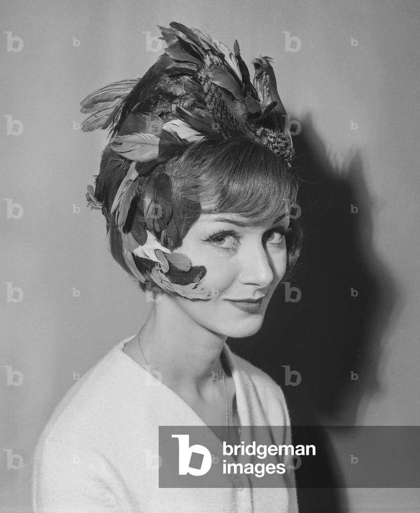Hairstyle by Molinario with feathers, September 21, 1960 (b/w photo)