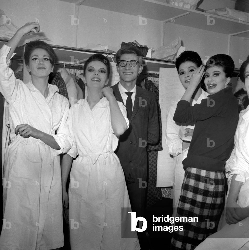 Yves Saint Laurent with his models after a fashion show, Paris, February 4, 1963 (b/w photo)
