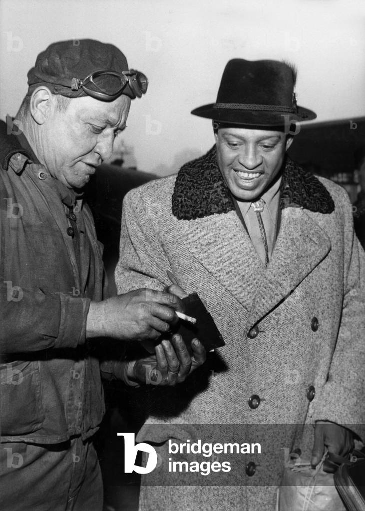 The Conductor Lionel Hampton Arriving at The Saint-Lazare Station in Paris , January 16, 1956 (b/w photo)