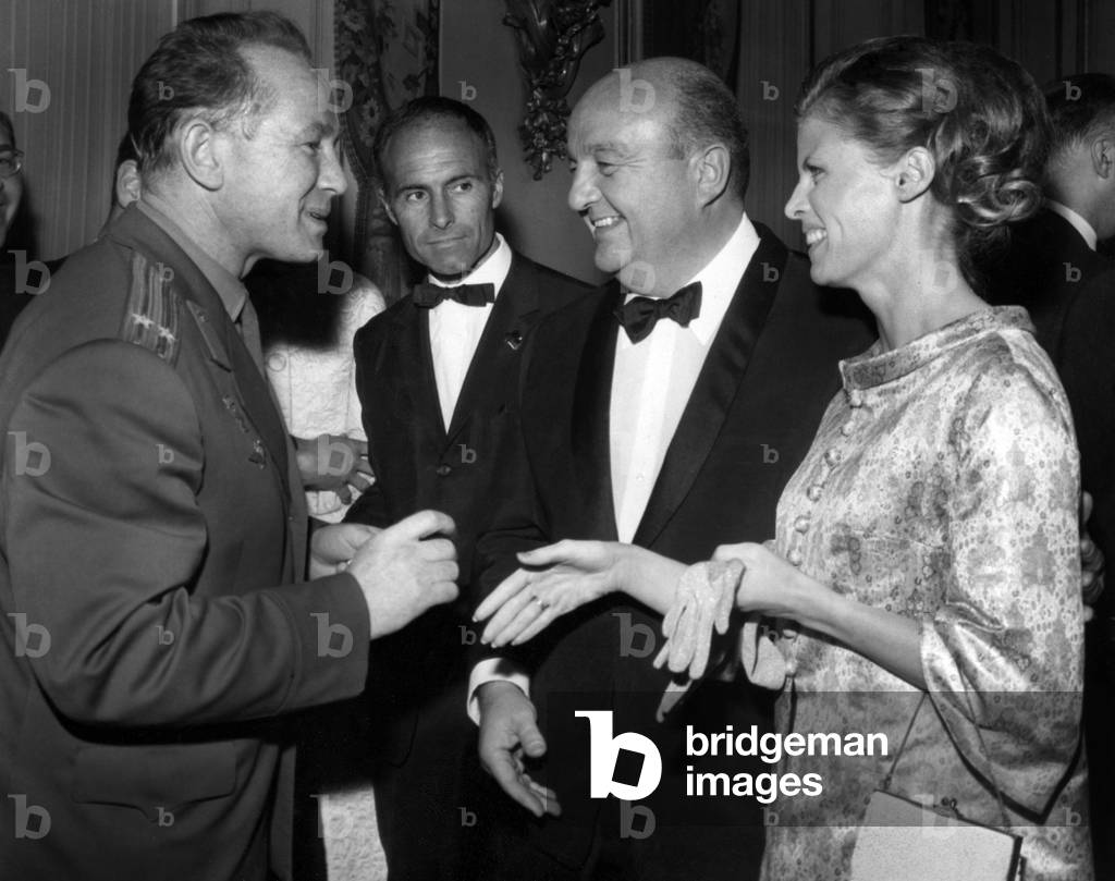 Premiere Of The Sovietic Film “War And Peace” From Tolstoi's Work At The Kinepanorama From The Avenue La Motte Piquet In Paris Here Cosmonaut Leonov Talking With Bernard Blier And His Wife On April 27, 1966 (b/w photo)