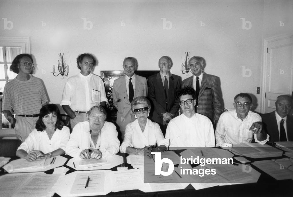 Members of Jury of Cannes Festival on May 16, 1989 : Seated : Sally Field, Georges Delerue, Christine Gouze Renal, Wim Wenders (President of Jury), Krzysztof Kieslowski ; Standing Peter Handke, Hector Babenco, Are Present Too Claude Beylie and Silvio Clementelli, Gilles Jacob (Standing, 2Nd From R) (b/w photo)