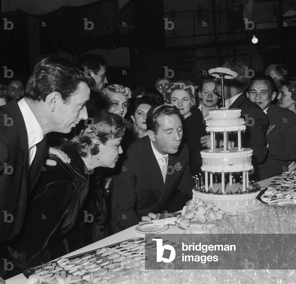 Charles Trenet celebrating his career, at the Alhambra in Paris, January 22, 1958 : Yves Montand, Simone Signoret, Charles Trenet, Philippe Clay (b/w photo)