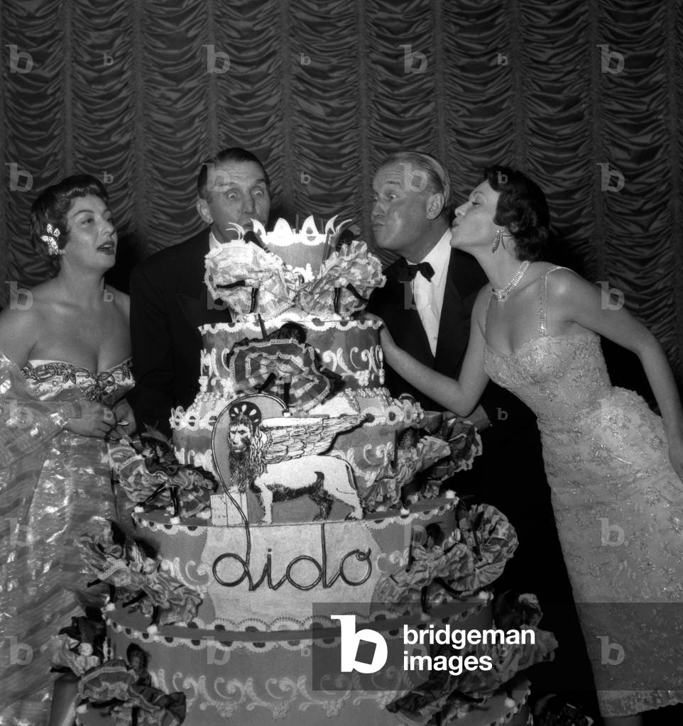 L-R : Viviane Romance, Georges Carpentier, Maurice Chevalier and Francoise Arnoul on December 22, 1954 at The Lido in Paris (b/w photo)