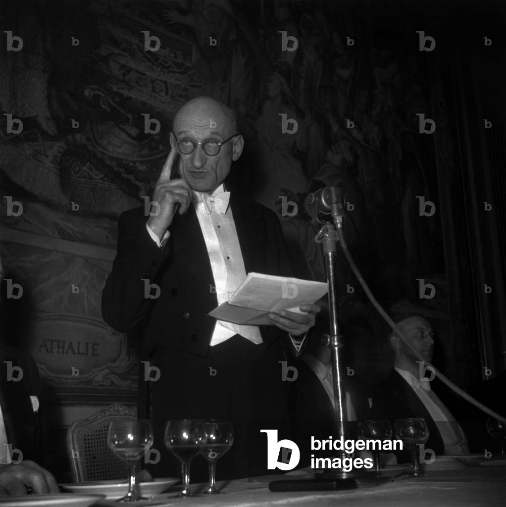 Robert Schuman Making A Speech during A Meal, Paris, February 17, 1948 (b/w photo)