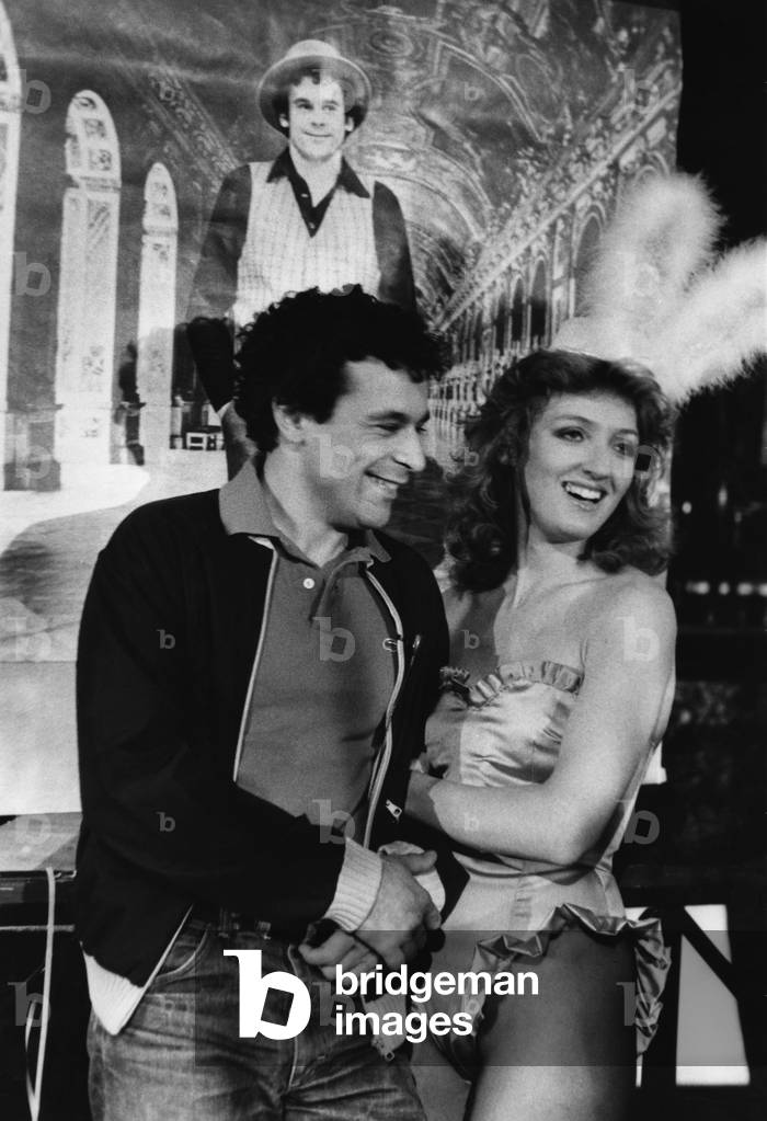 Francis Perrin With Charlotte De Turckheim Who Embodies A Little Rabbit (A Bunny Girl) In The Issue Of Varietes La Folle Story Of Francis Perrin Realised By Claude Longin. Here April 22, 1982 (b/w photo)