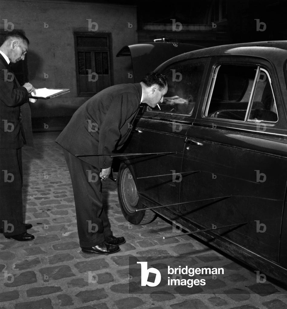 Attack of The Observatory Against Francois Mitterrand on October 16, 1959. here in The Court of Prefecture of Police Force The Experts Examine The Impacts of The Balls on November 16, 1959  (b/w photo)