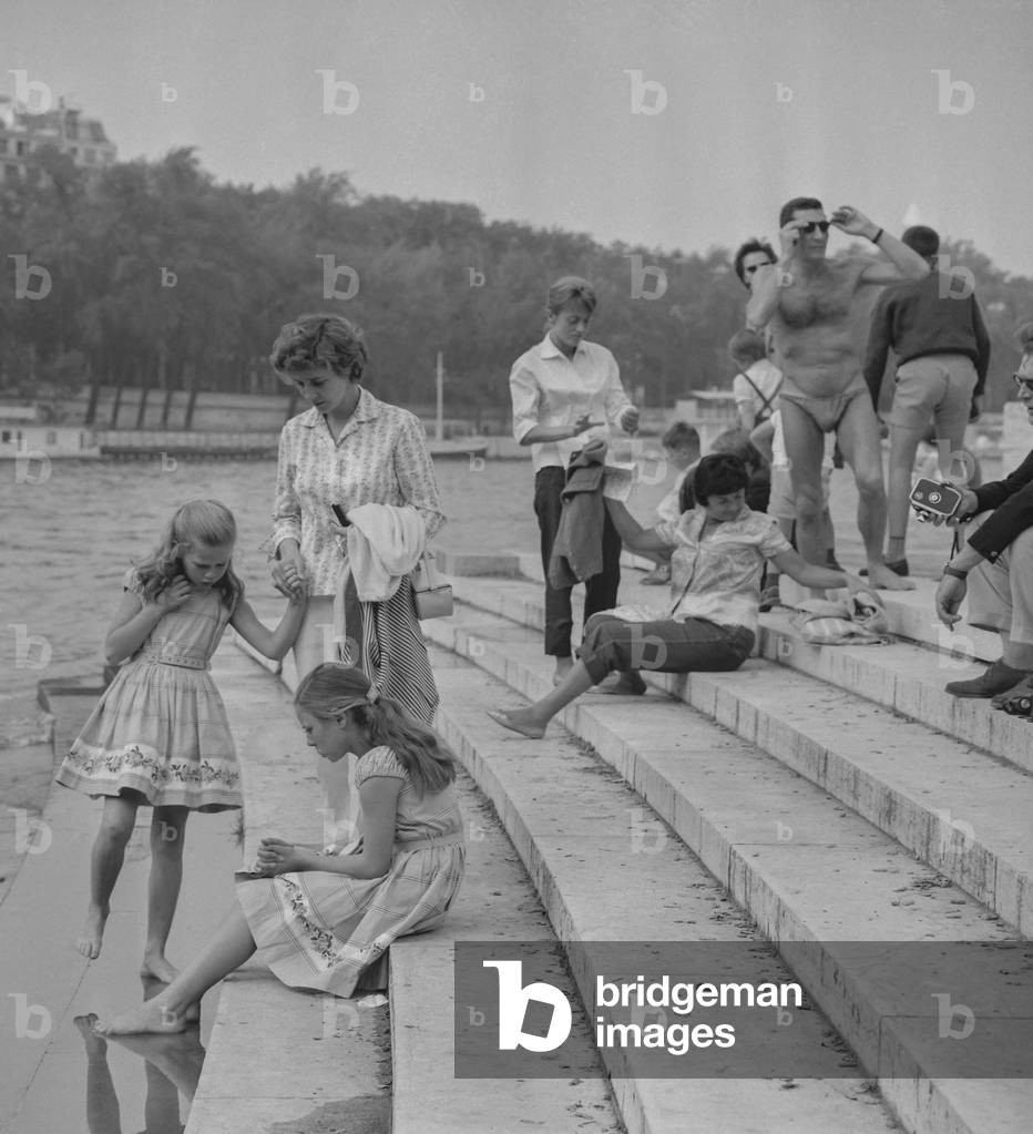 Just before the start of the new year school, people enjoying the good weather and the Seine river, Paris, September 9, 1960 (b/w photo)