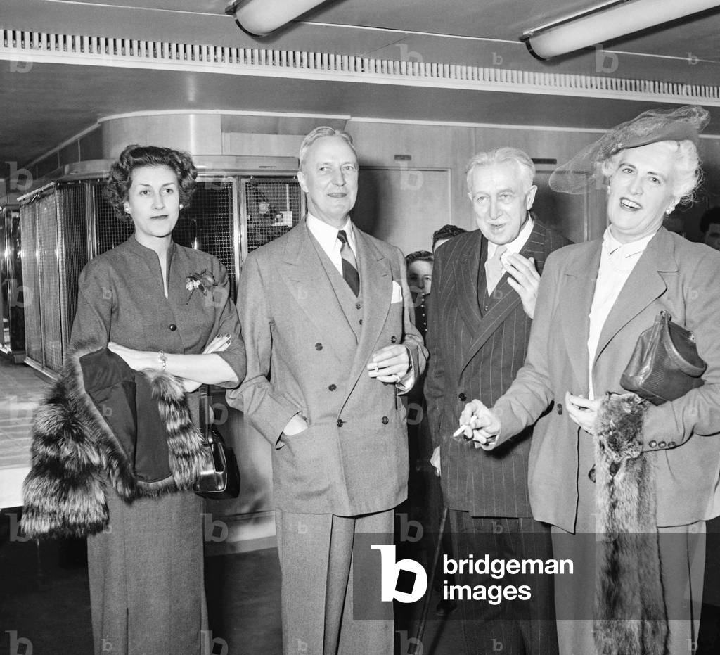 French president VincentAuriol leaving for USA, Paris, March 20, 1951 : Mr and Mrs David Bruce, ambassadeur of USA in Paris, with Mr and Mrs Georges Vanier, ambassador of Canada in Paris (b/w photo)
