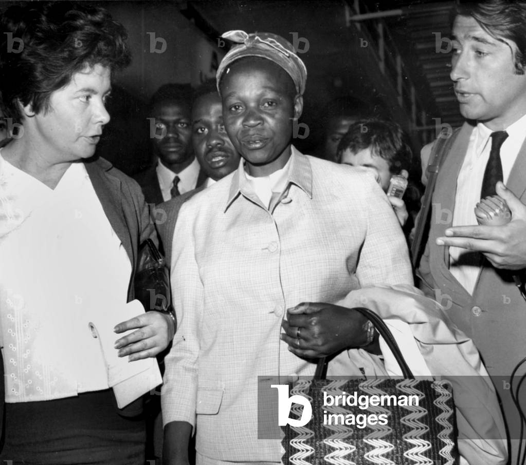 Mrs Tshombe Wife of Former Prime Minister of Congo Moise Tshombe at That Time Prisoner in Algeria here Arriving in Paris With Mr Mounongo and her Son To Meet Lawyer Floriot in Charge of her Husband'S Defence July 5, 1967 (b/w photo)