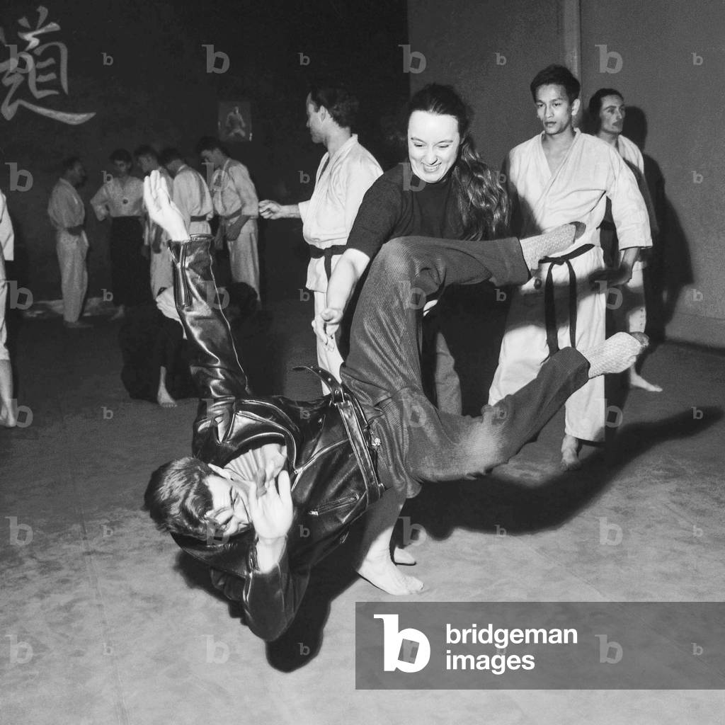 Magali Depouys, French journalist, taking self-defence lesson in Paris, April 2, 1959 (b/w photo)