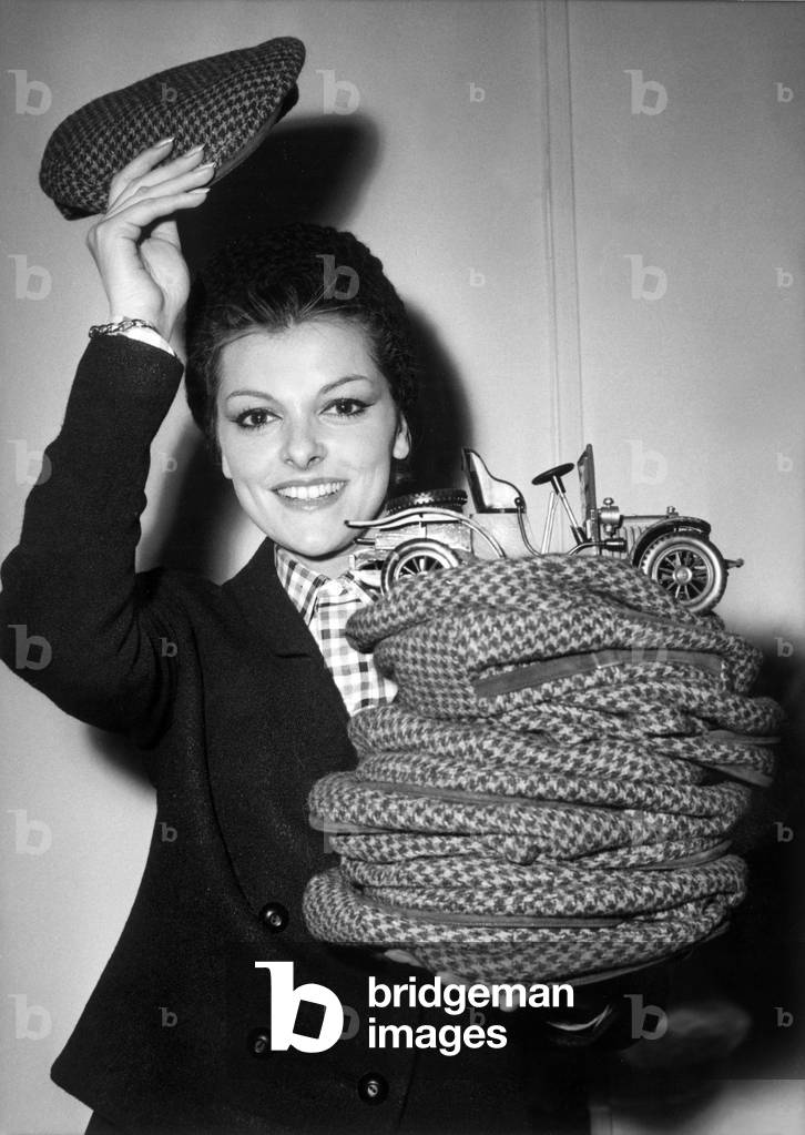 French Comedian Perrette Pradier Presenting The Cap For Monte-Carlo Rallye on January 10, 1964 (b/w photo)