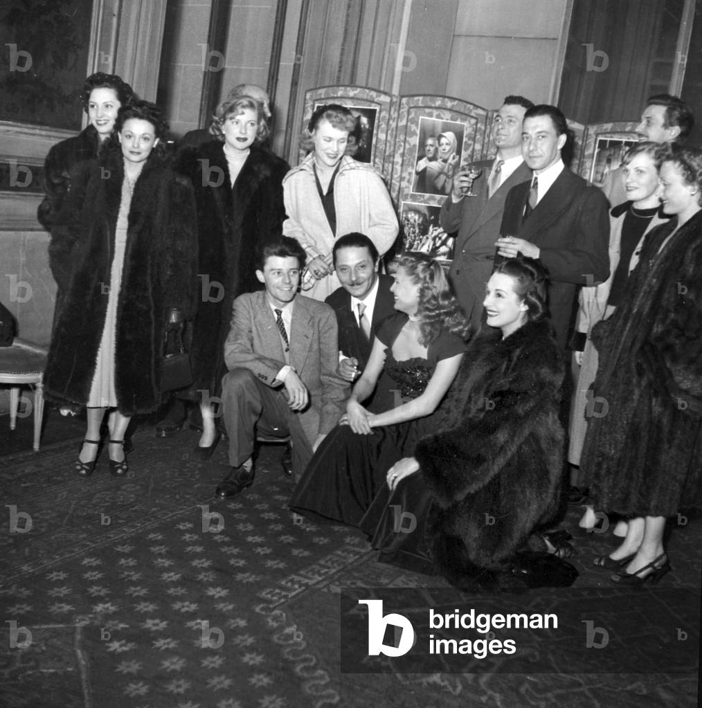 Reception Organized By Italian Director Alessandro Blasetti, Paris, March 20, 1949 : here He'S Surrounded By Gerard Philipe, Marcelle Derrien, Micheline Francey, Roger Pigaut, Paul Meurisse, Colette Richard, Louise Carletti and Danielle Godet (b/w photo)