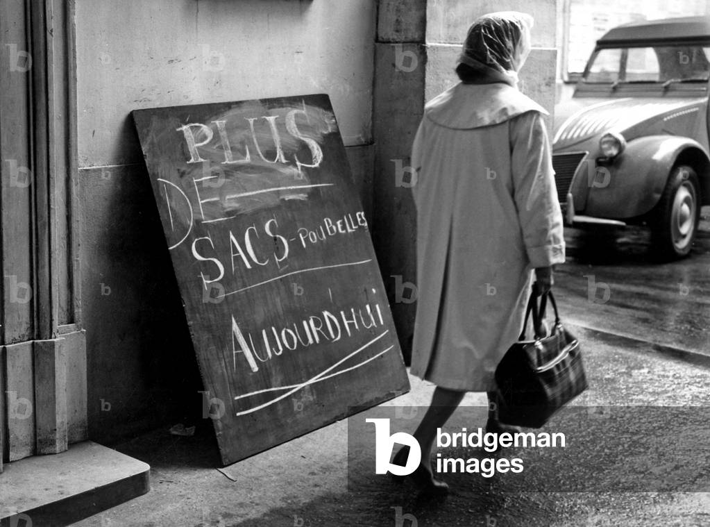 Strike of Dustmen in Paris : A Board in A Town Hall Anouncing Shortage of Bin Liner on May 22, 1968 (b/w photo)