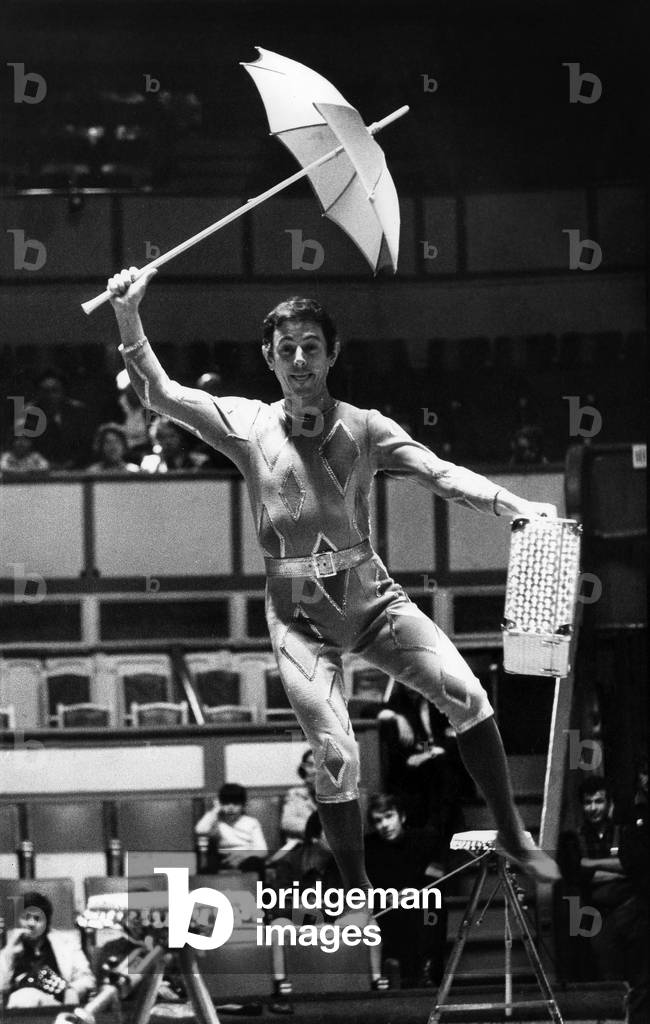 Jacques Duby During The Repetition Of His Number For The Gala Of The Union Of Artists At Cirque D'Hiver Walking On A Rope Above The Vacuum, An Umbrella With One Hand, A Suitcase With Another On April 22, 1971 In Paris. (b/w photo)