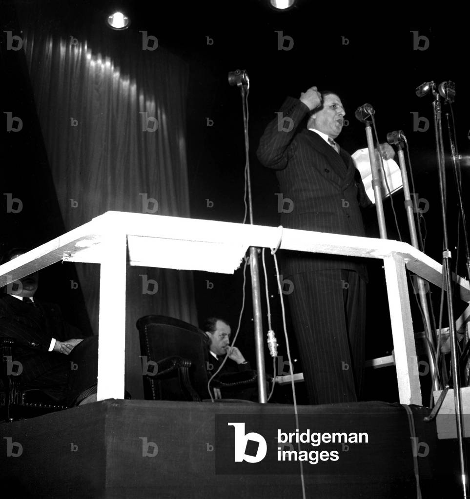 General Charles De Gaulle Making A Speech in Paris on February 11, 1950. Background : Andre Malraux (b/w photo)