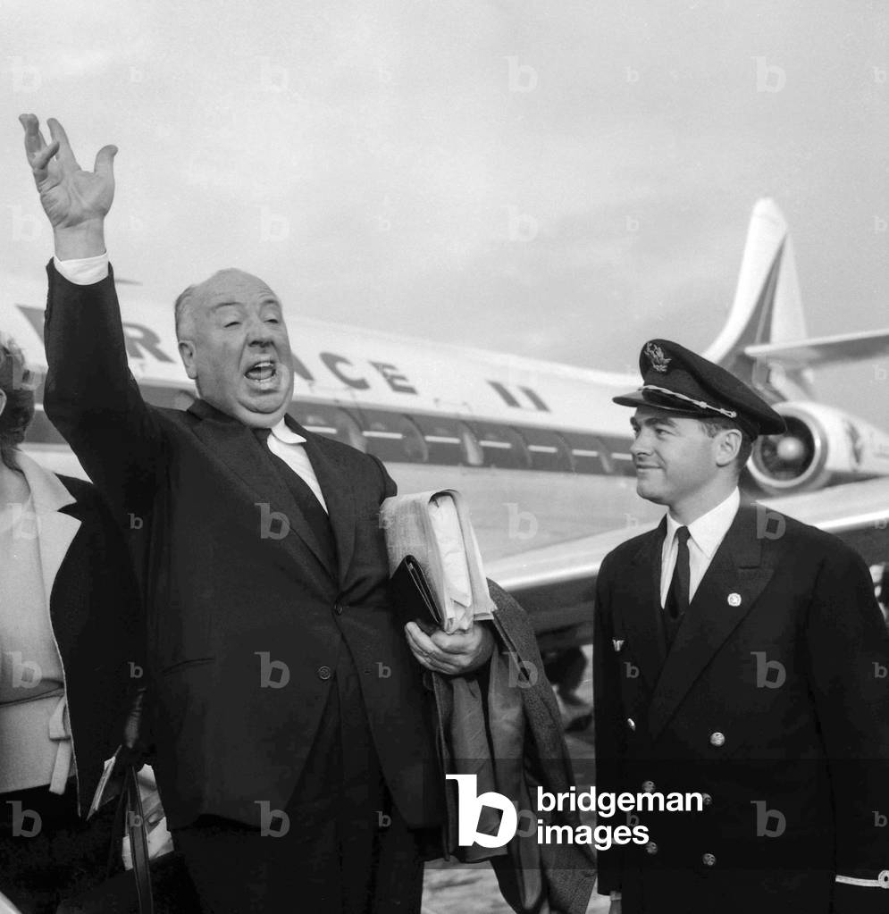 American director Alfred Hitchcock arriving at Orly airport in Paris, on October 1, 1960 (b/w photo)