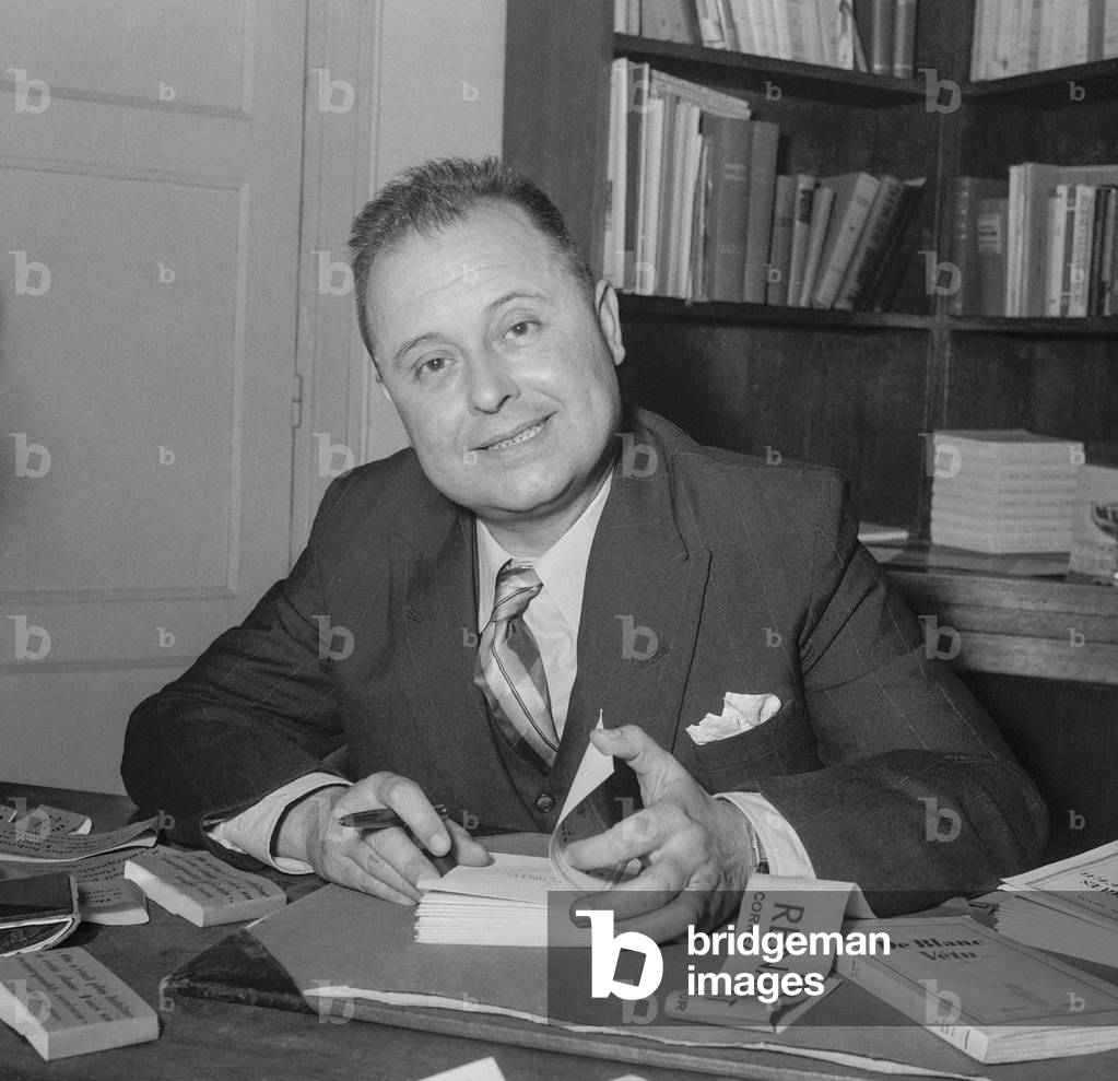French writer Pierre Molaine (Leopold Faure) signing his book 