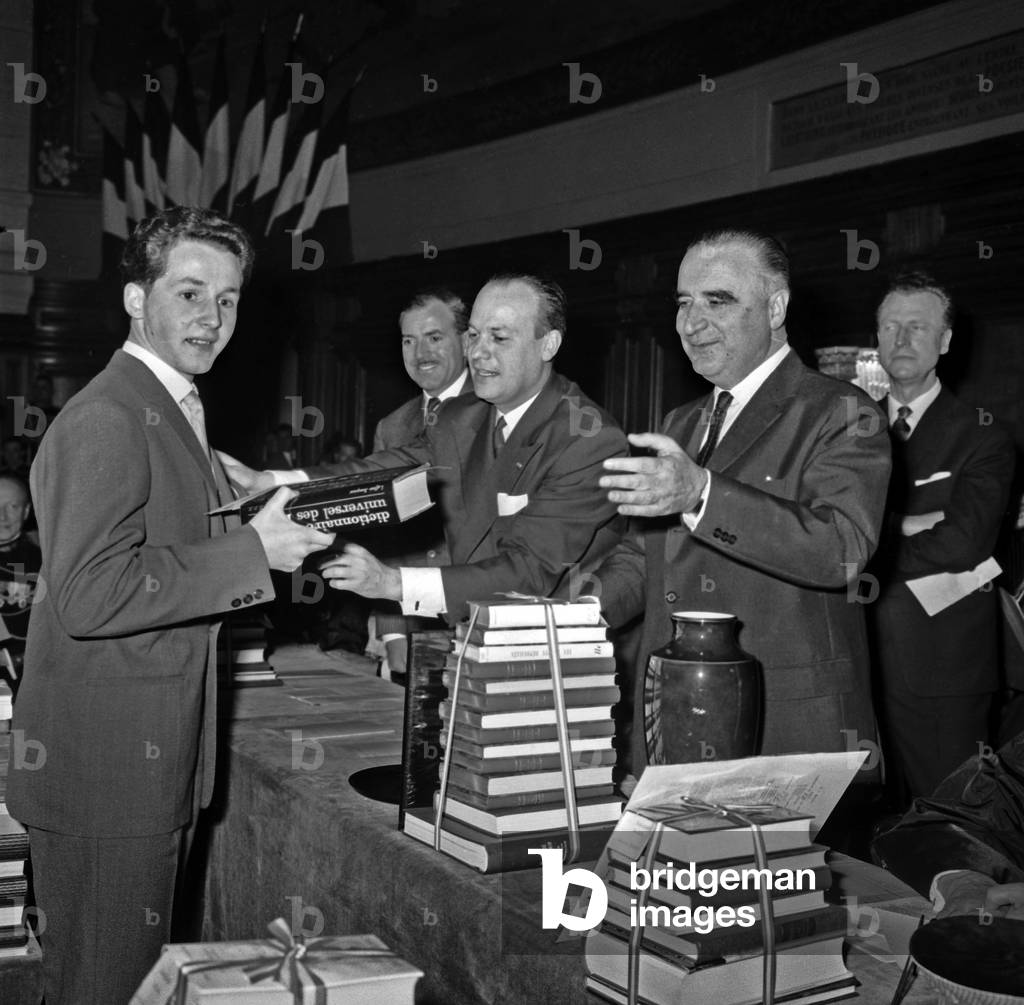 French Prime Minister Georges Pompidou (1911-1974) With Minister of Transport and Housing Pierre Sudreau (1919-2012) Presenting Awards, in The Sorbonne University. at The Background, French Politician Maurice Herzog. Paris, France, June 22Th, 1962. (b/w photo)