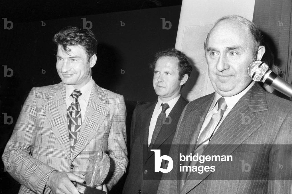 Lucien Neuwirth (R) With Raymond Poulidor (L) at Bike Fair in Paris on October 13, 1977 (b/w photo)