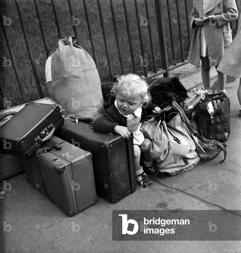 Holiday Departure, Paris, 1945 : A Child Among Luggage (b/w photo)