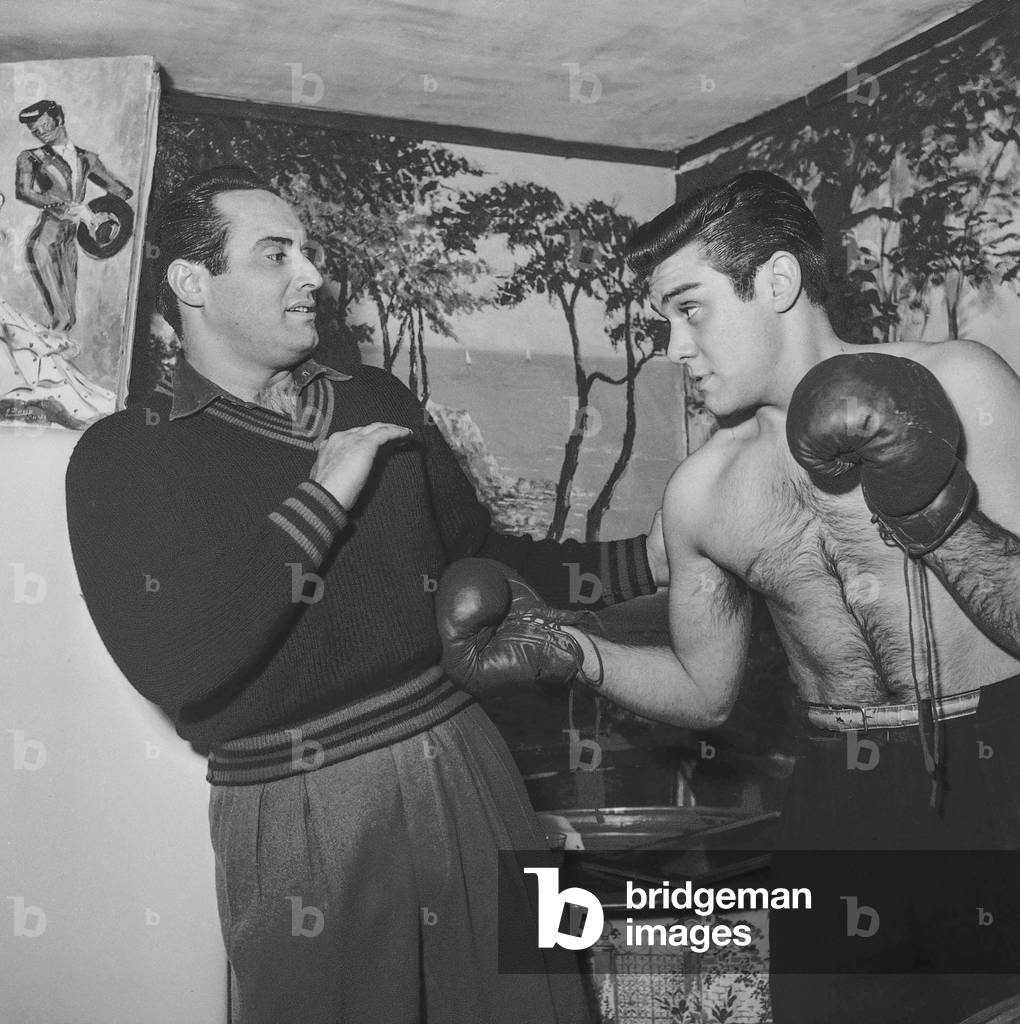 Michel Coppola (l) bandit Giuliano look-alike, here at home, Paris before filming of 