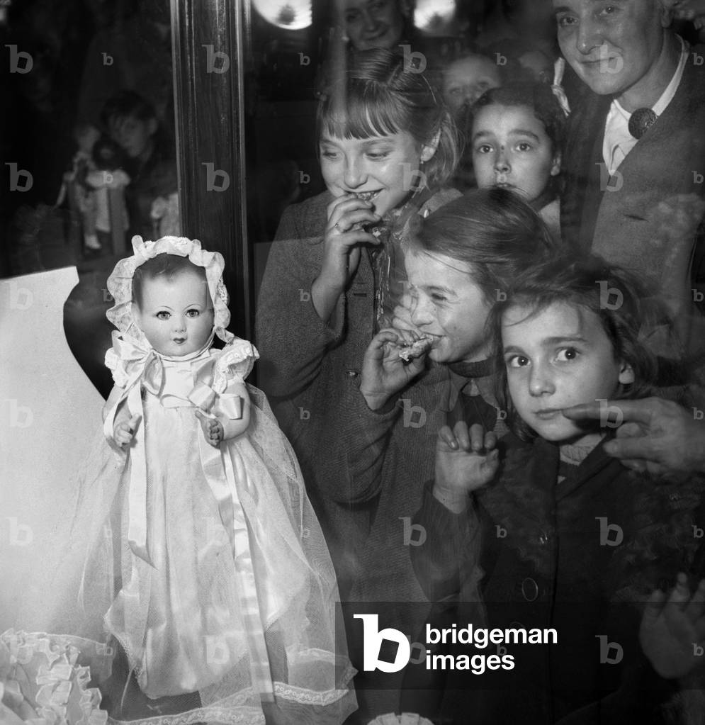 Little Girls Looking at A Doll in The Sho Window, Christmas, Paris, December 1948 (b/w photo)