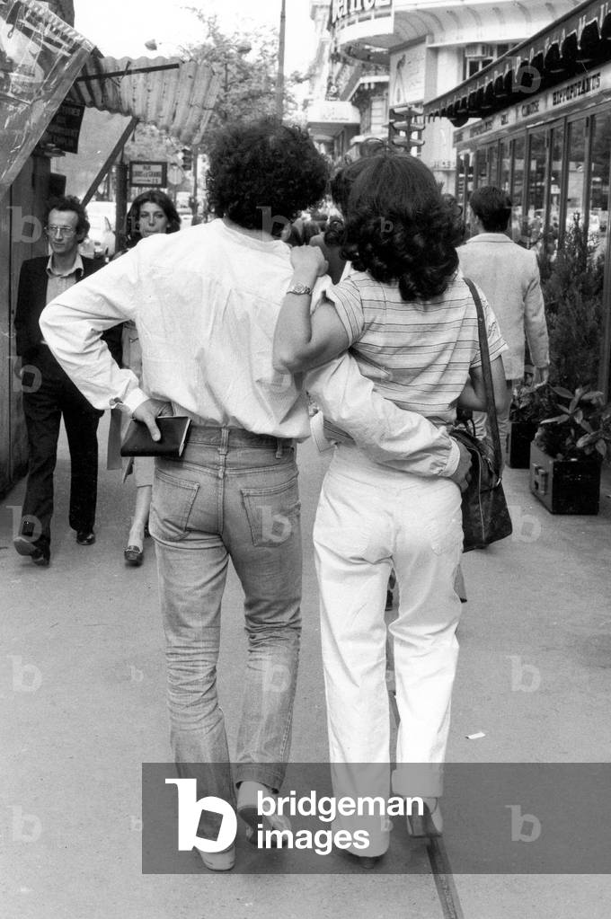 Couple Walking in The Street in Paris May 25, 1979 (b/w photo)