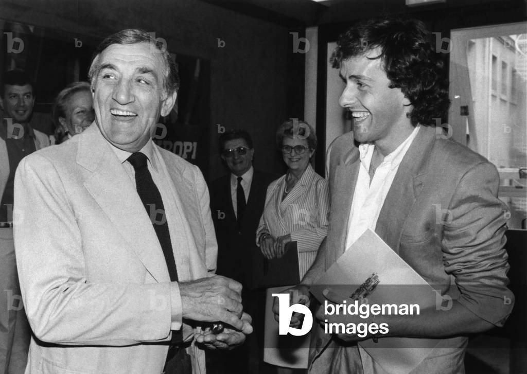 Michel Platini, Footballer De La Juventus De Turin, Presented The Keys Of A Minibus Daily Wins At “Mundial” In Lino Ventura For His Foundation “Pierce Neige” June 16, 1983 (b/w photo)