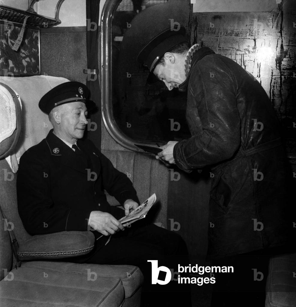 Ticket Inspector in A Train, March 1947 (b/w photo)