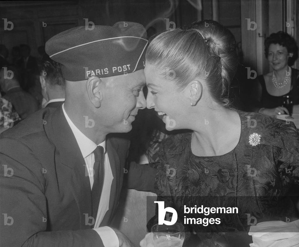 American actor Yul Brynner who has received the American Legion medal, and his wife during an evening at the American Legion in Paris, September 3, 1960 (b/w photo)