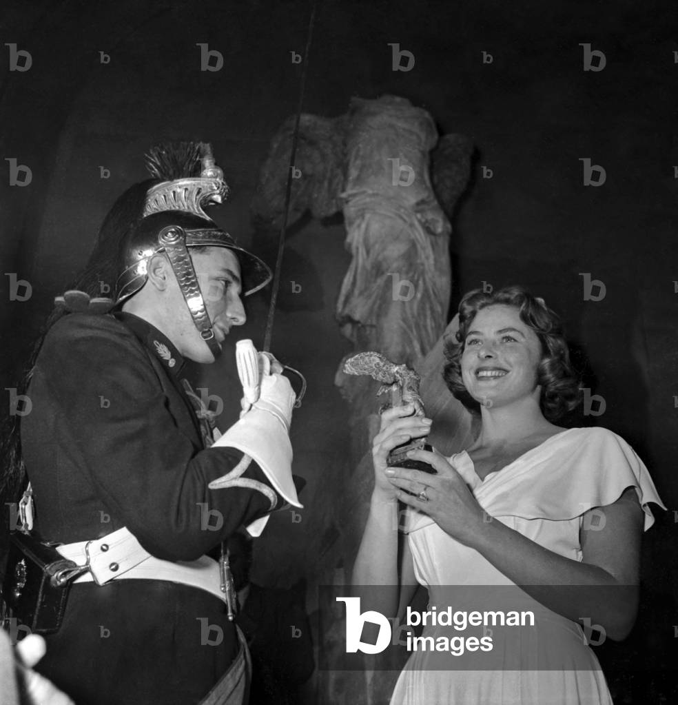 Victoires Du Cinema Francais Prize Giving Ceremony at The Louvre Museum in Paris in Front of The Winged Victory of Samothrace, September 26, 1948 : Ingrid Bergman (b/w photo)