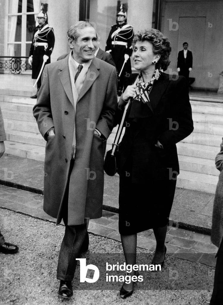 French Minister of Housing Paul Quiles and Edith Cresson Minister of Foreign Trade Leaving Elysee Palace After Ministers Council C.1983 (b/w photo)